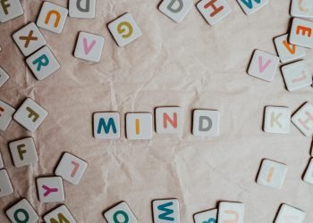 Multicoloured Letters on Paper Background